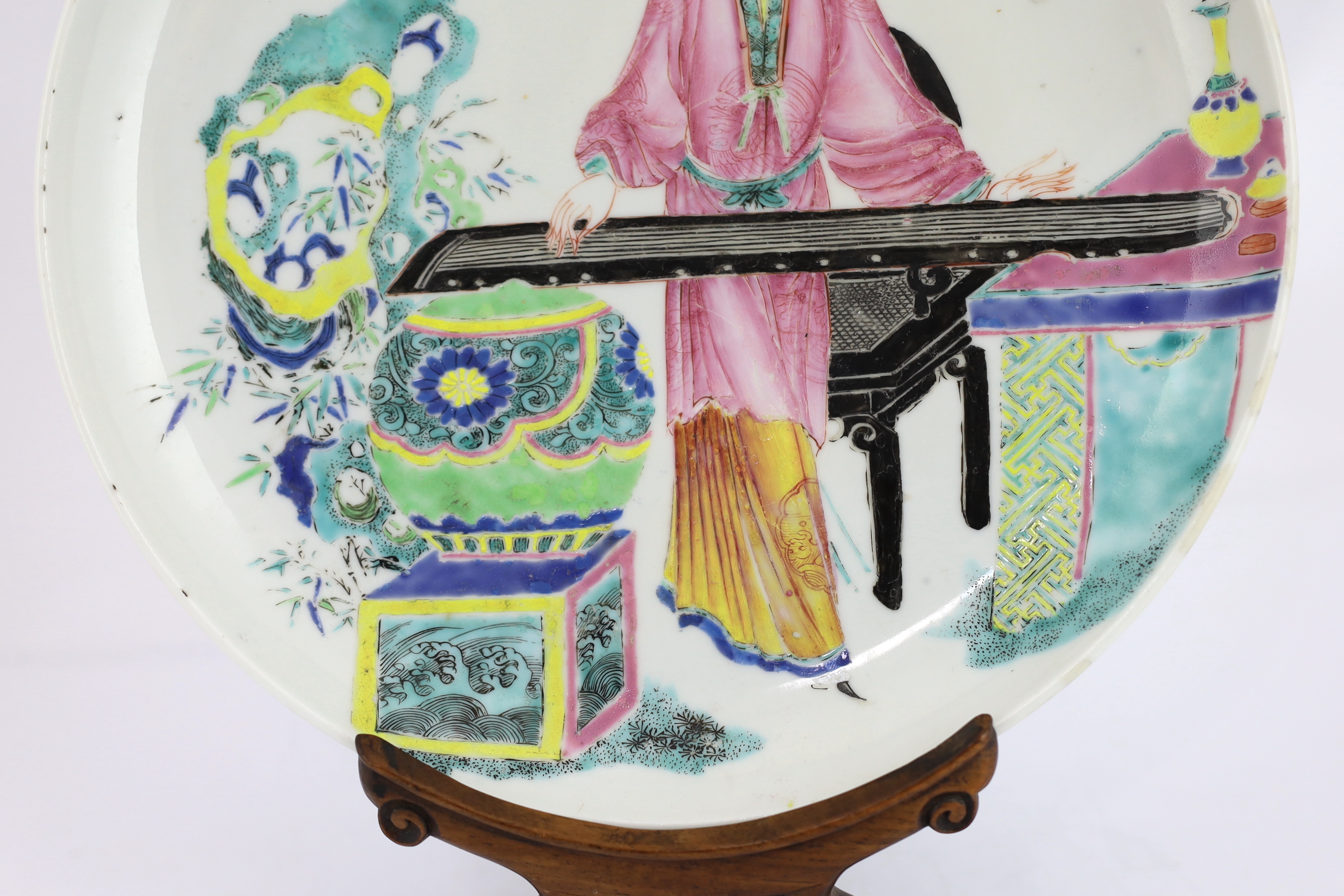 A Chinese famille rose saucer dish, Yongzheng period, repainting to enamel colours, Please note this lot attracts an additional import tax of 5% on the hammer price